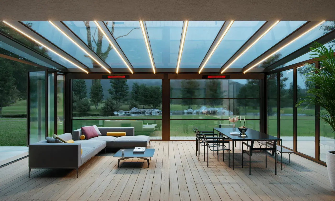 Glass-roofed winter garden in daylight with linear LED lights along the ceiling